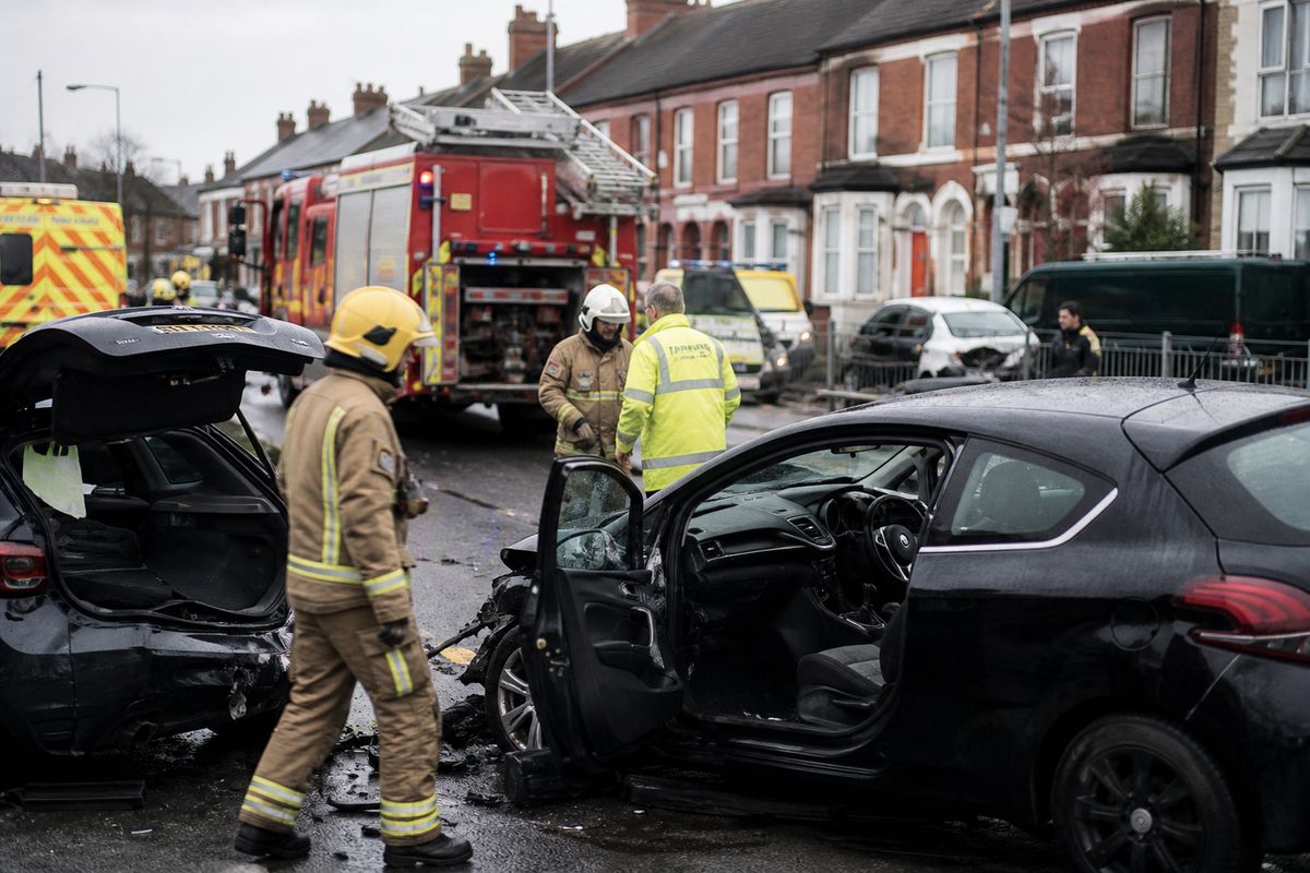 Emergency responders at a Liverpool road collision scene