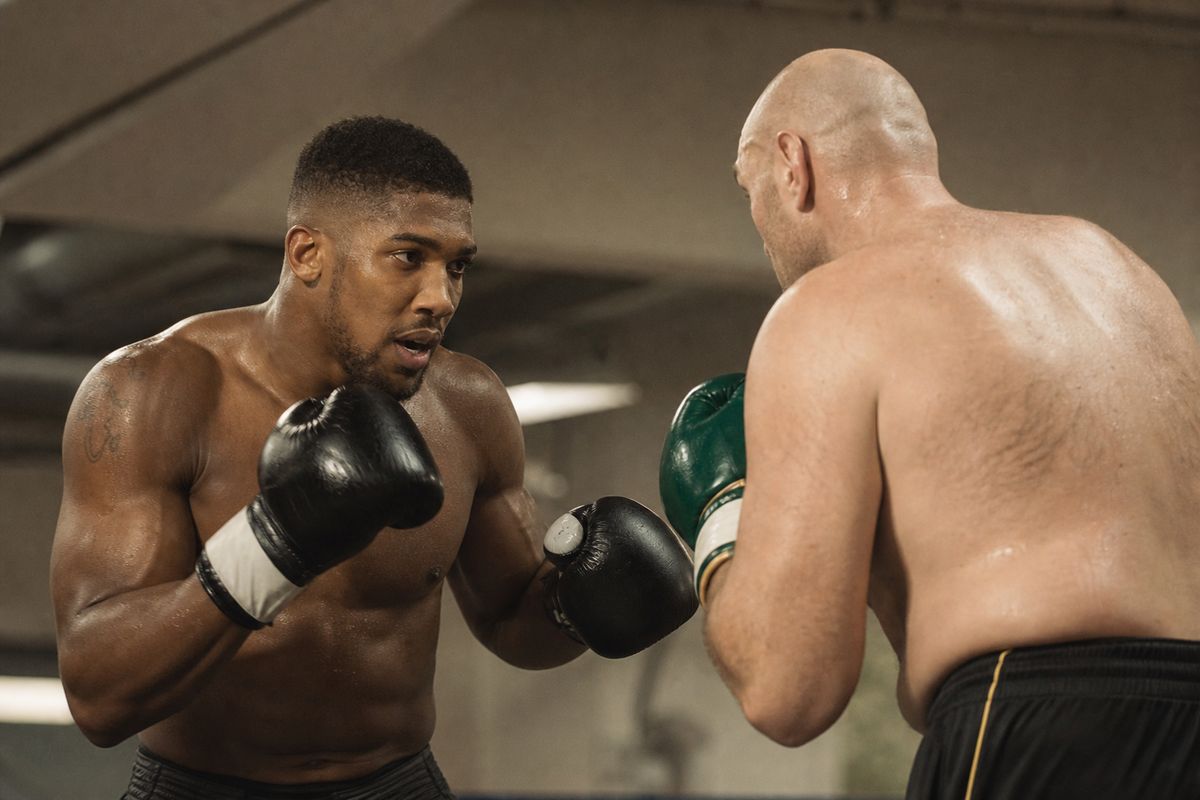 Anthony Joshua and Tyson Fury sparring in a boxing gym