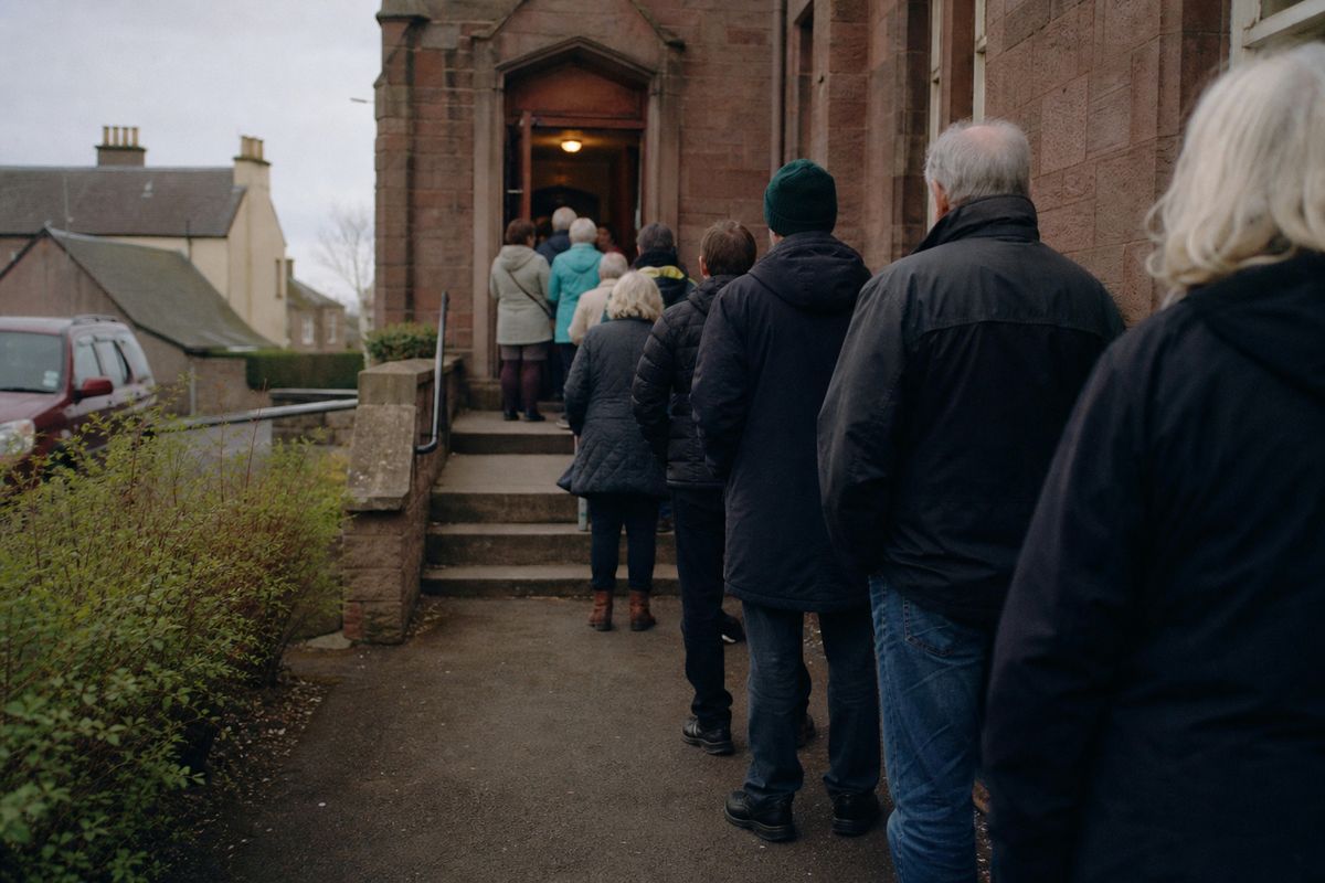 Voters queuing outside a polling station in Arbroath.