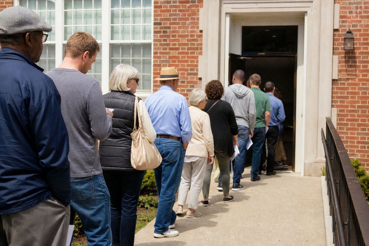 Voters lining up outside a polling station on election day