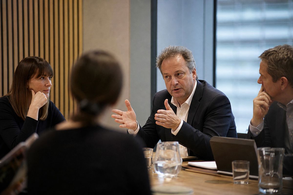 BBC executives discussing entertainment strategy in a modern meeting room