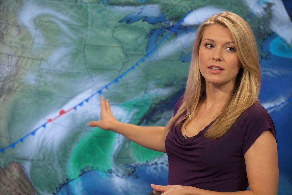 A meteorologist presenting a weather forecast on TV