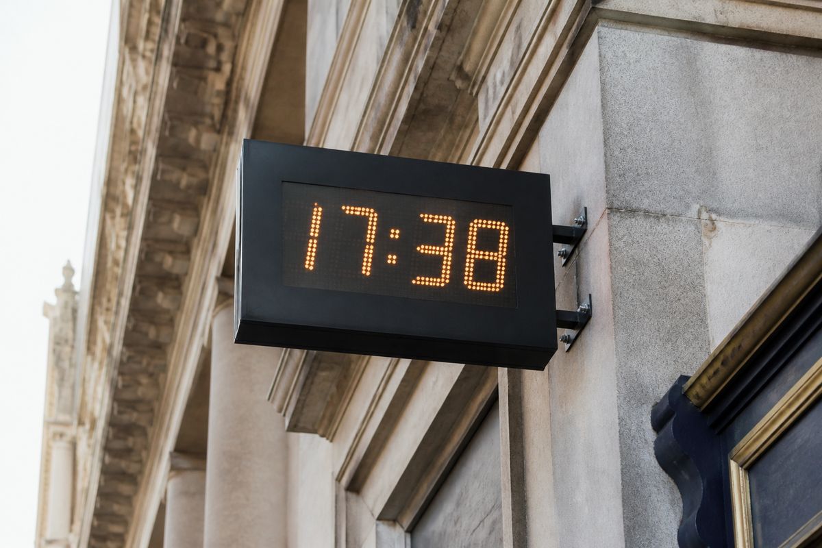 A digital clock displaying the current time in Cardiff