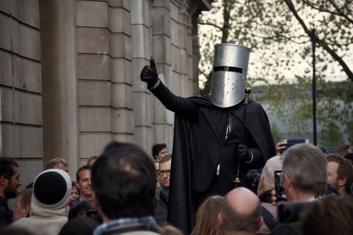 Count Binface campaigning amid a lively street crowd