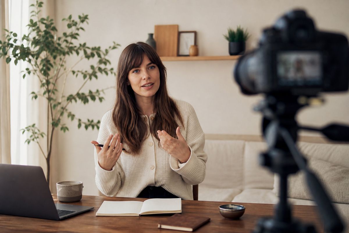 A creator filming a personalized online course at home studio