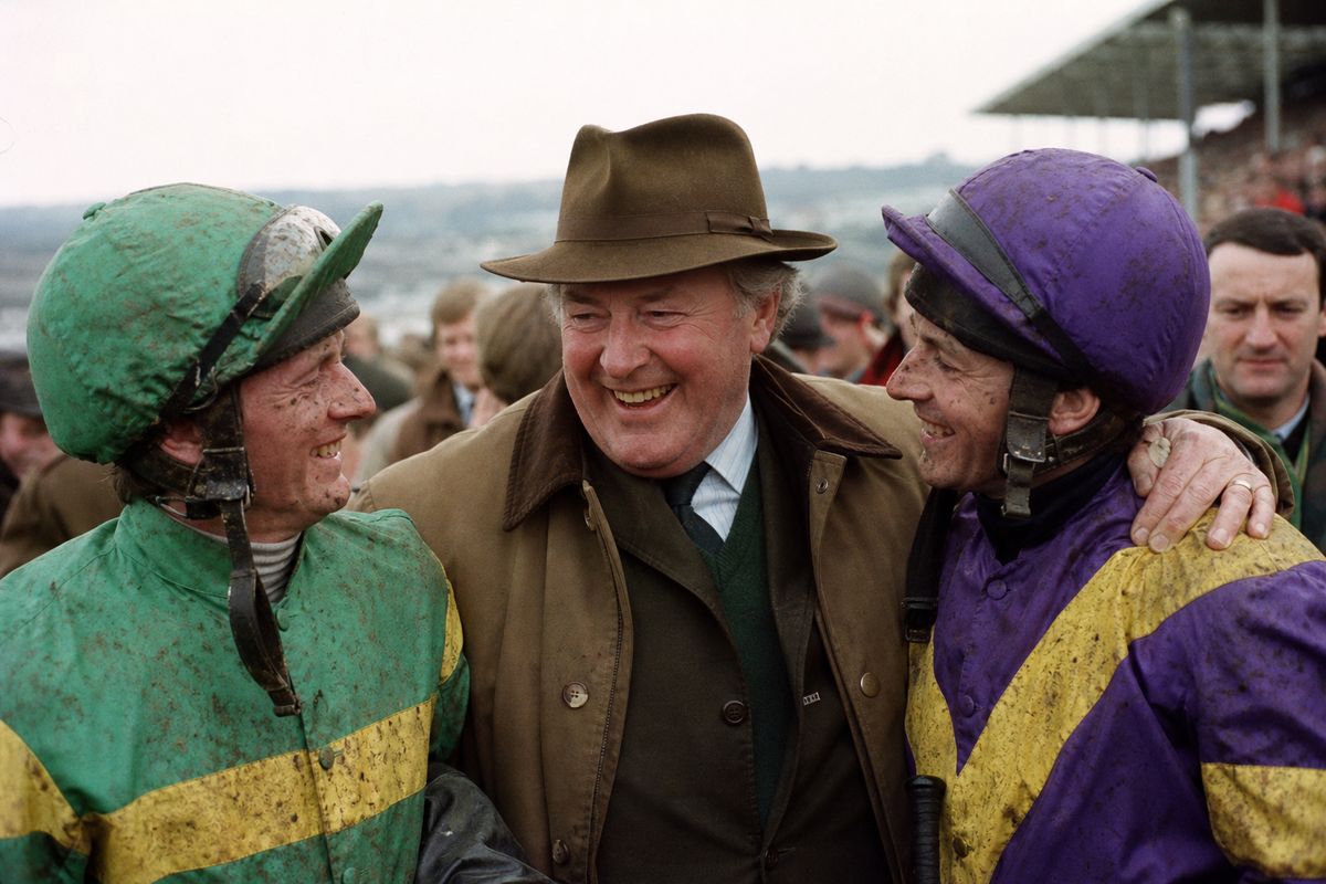 JP McManus celebrating with jockeys after Grand National win