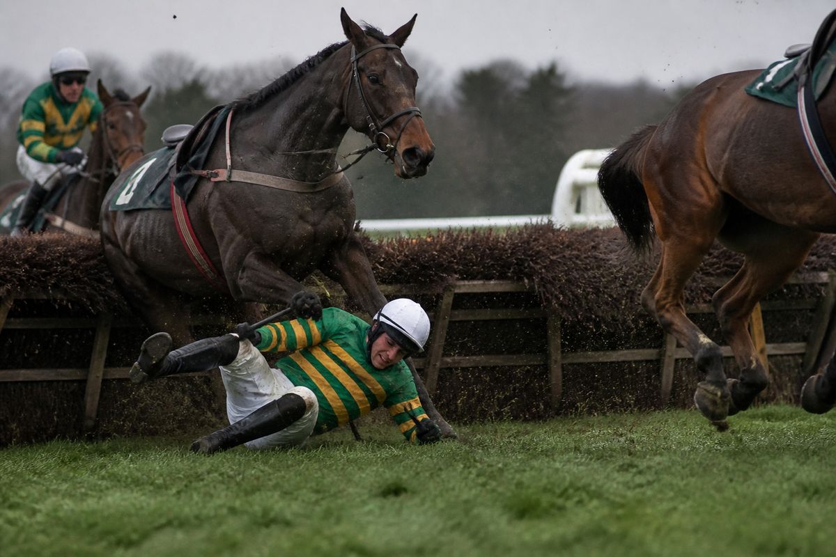 Jockey Patrick Mullins falling at the first fence during race