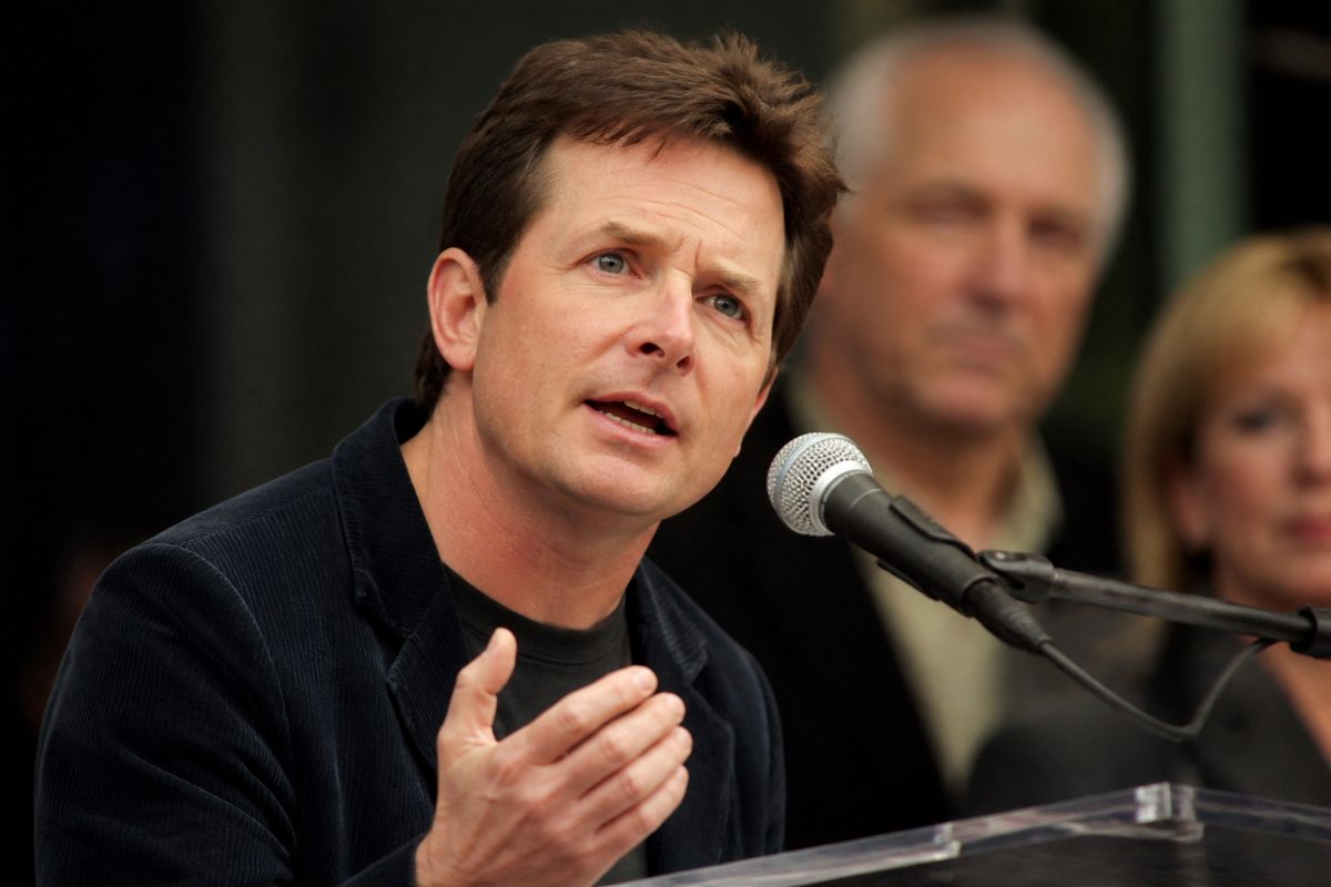 Michael J. Fox speaking passionately at a Parkinson’s advocacy event