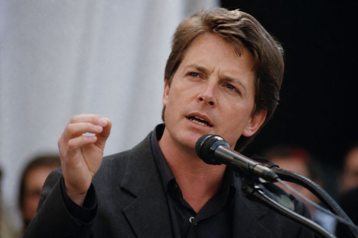 Michael J. Fox speaking passionately at a Parkinson’s awareness event