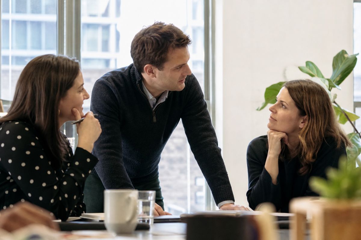 Michael J. Fox Foundation staff collaborating in a modern office.