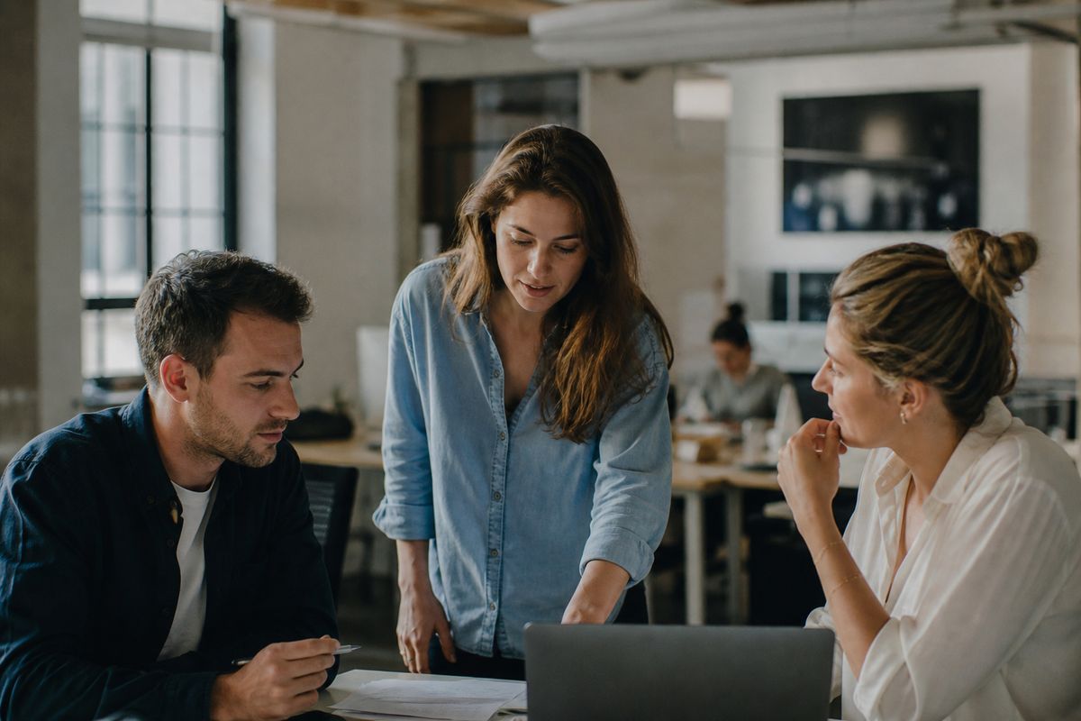 Employees collaborating in a modern office workspace