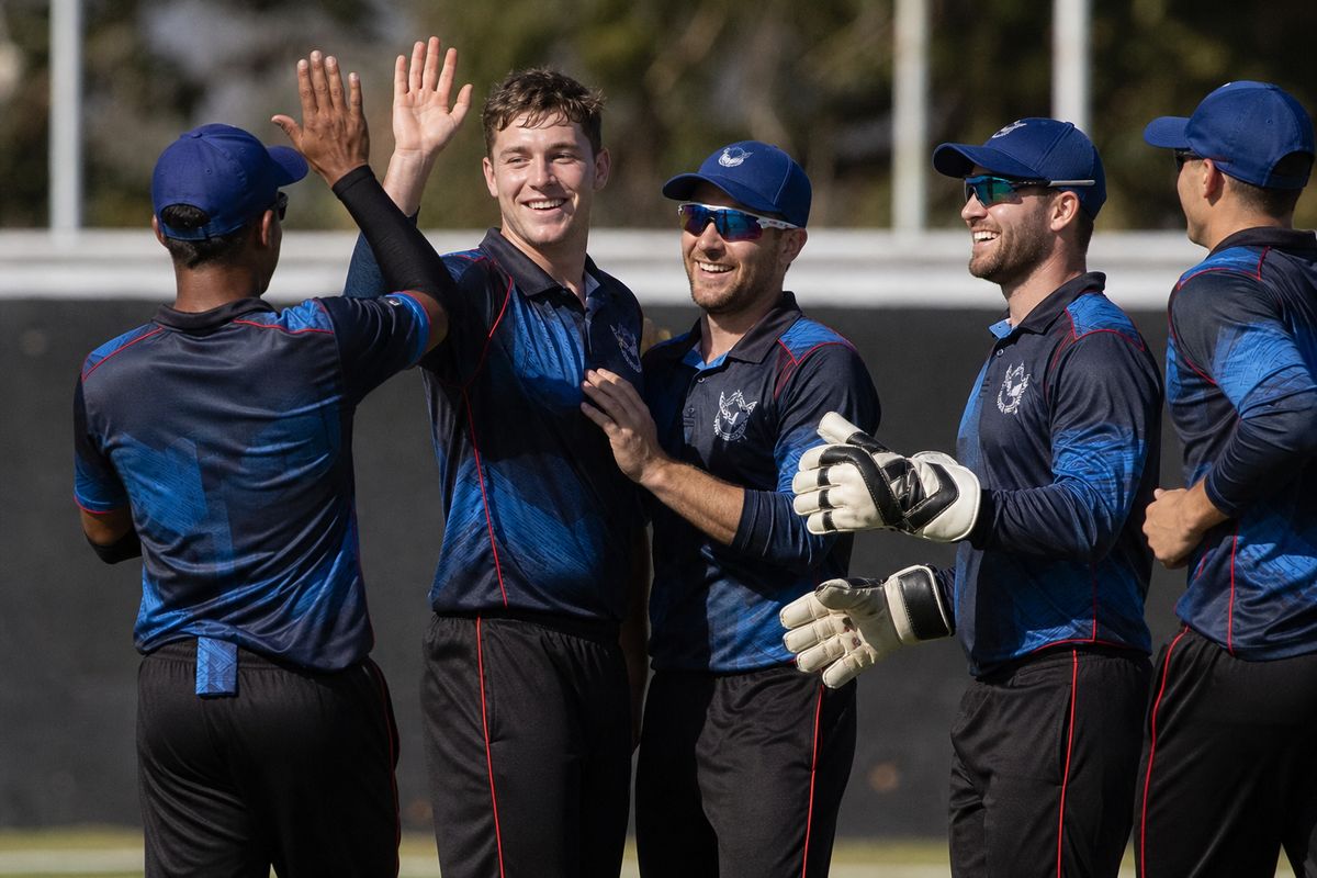 Namibia cricket team celebrating a crucial wicket on the field