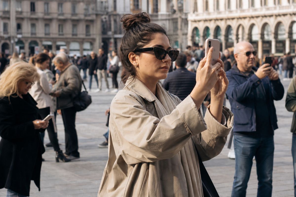 Participants using smartphones in a bustling city square