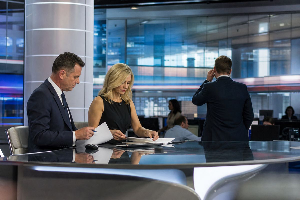 A Sky Sports newsroom with anchors preparing for broadcast