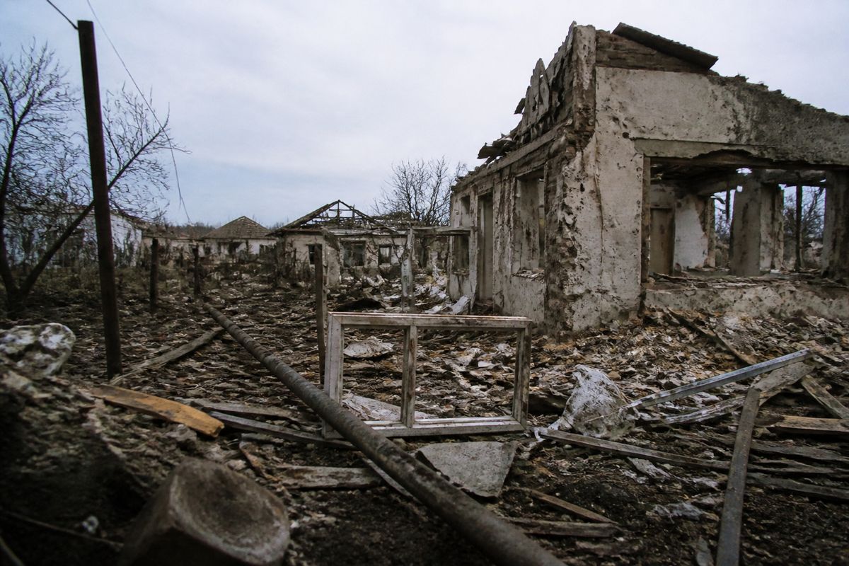 Destroyed buildings amid rubble in a shelled Ukrainian village