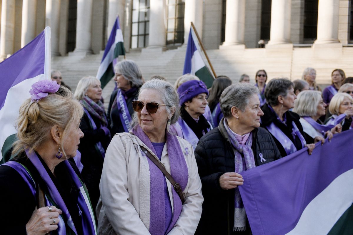 WASPI campaigners gathered outside a courthouse holding banners