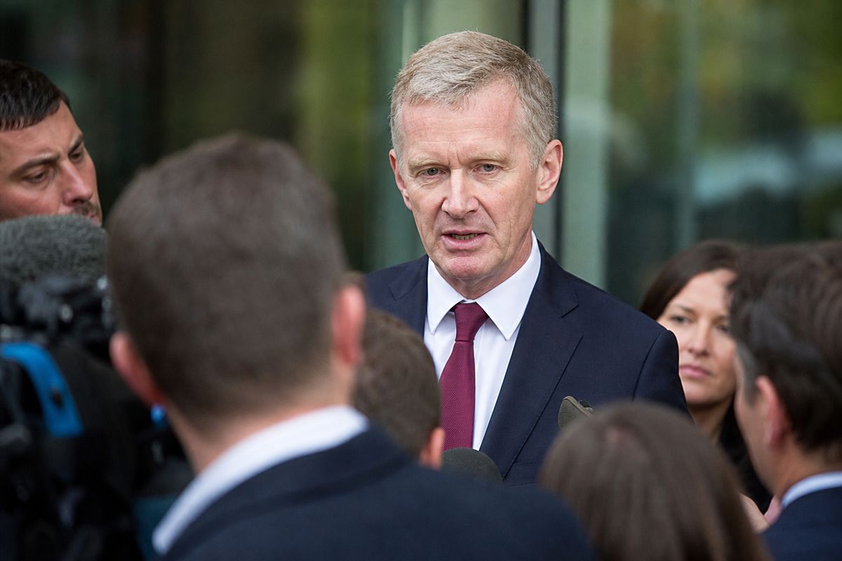 Jeremy Miles speaking at a crowded press conference