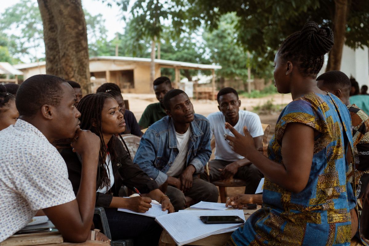 Young Liberian entrepreneurs receiving hands-on business training outdoors
